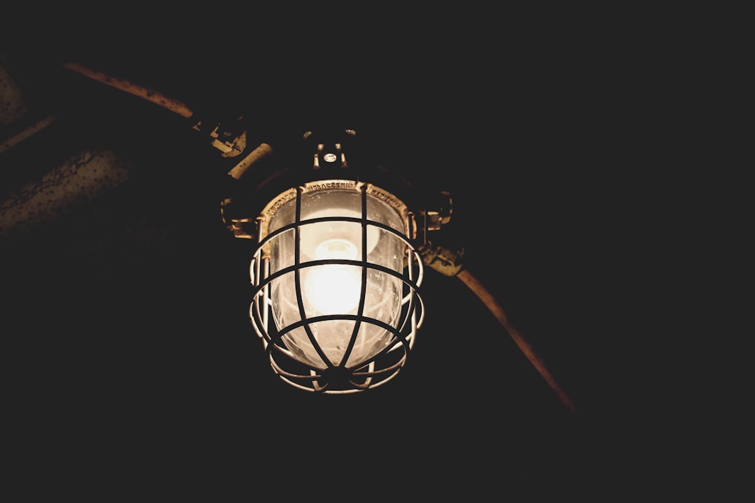 Photo industrial cage style wall sconce